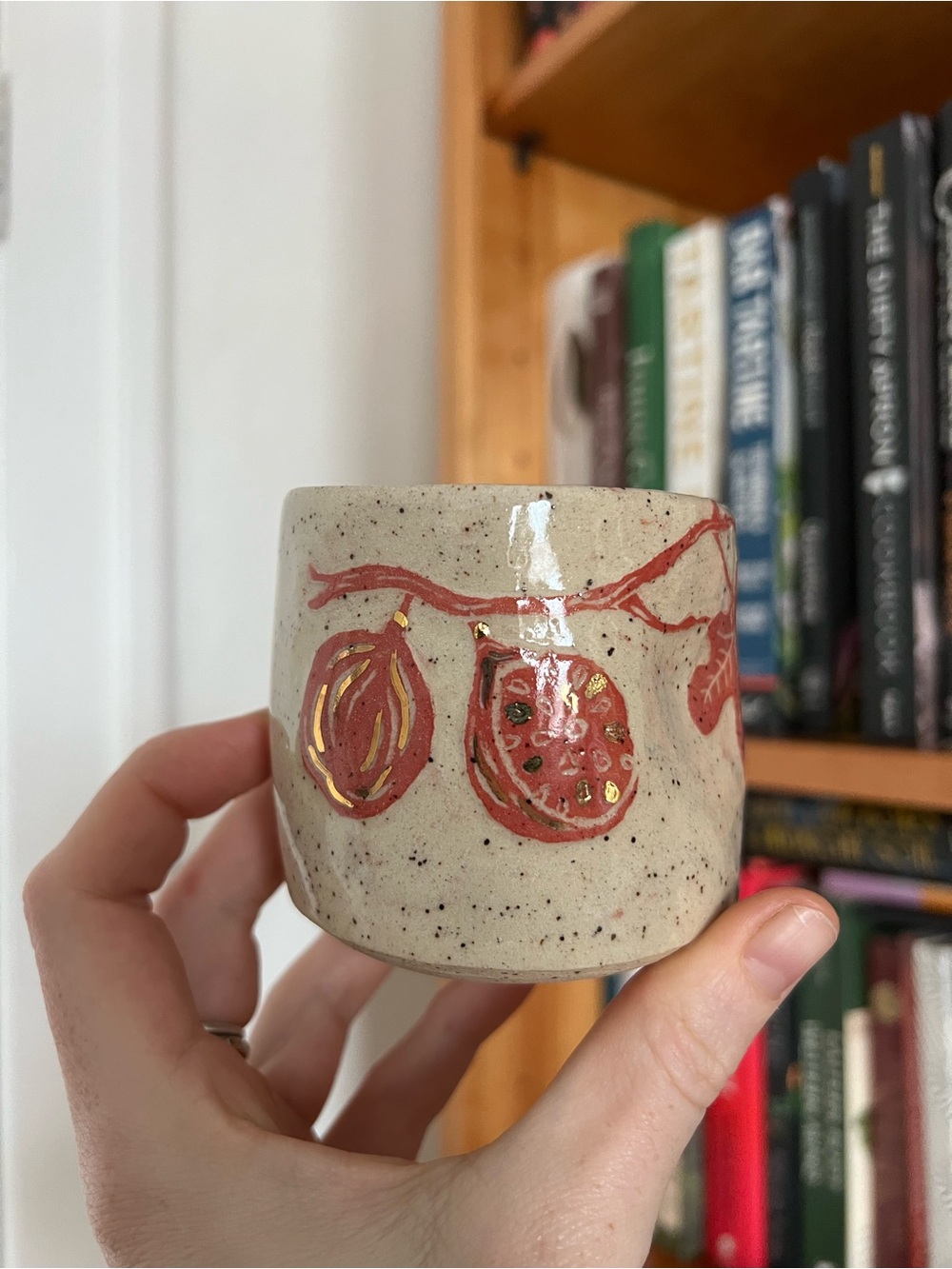 Speckled fig in red & gold cup.